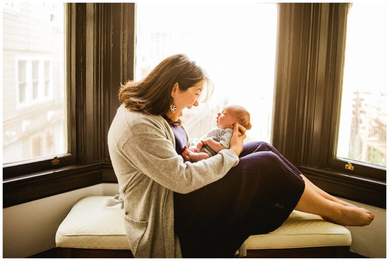mother holds newborn in san francisco at home