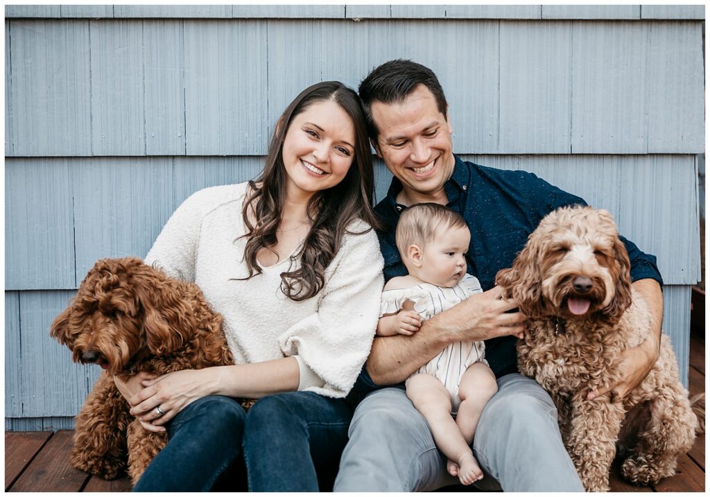marin family with baby and dogs