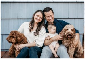 marin family with baby and dogs