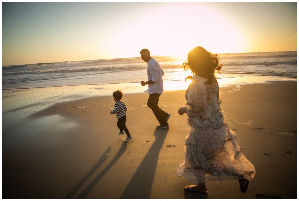 pregnant woman poses on Half Moon Bay beach for maternity photos