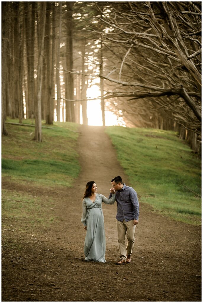 pregnant woman poses on Half Moon Bay beach for maternity photos