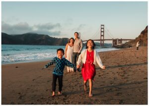 children run on san francisco beach