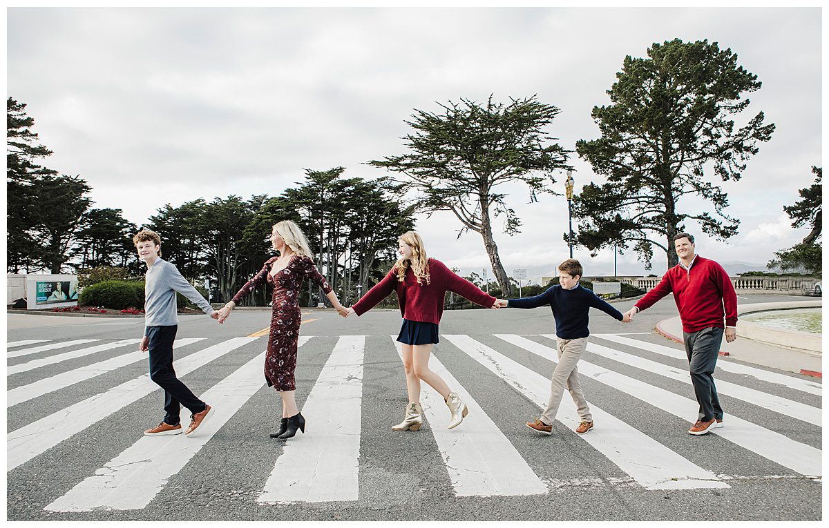 family crossing street in front of legion of honor