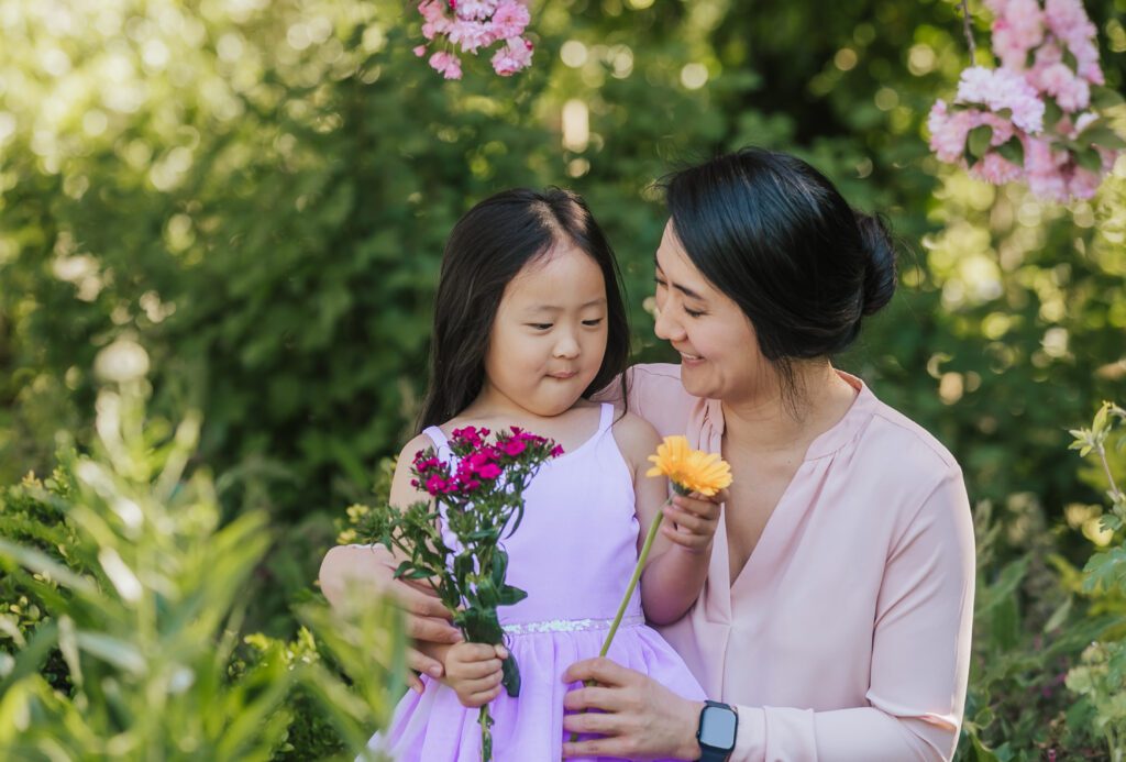 mother looks at daughter in flowers in walnut creek, ca