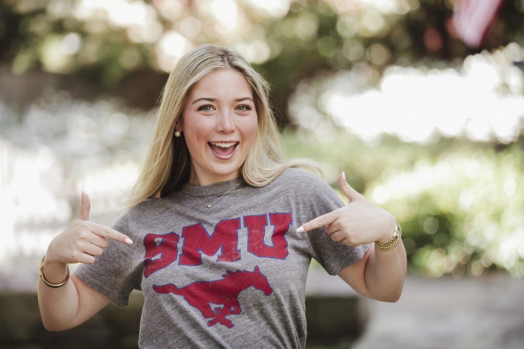 high school senior girl points to college flag in walnut creek, ca