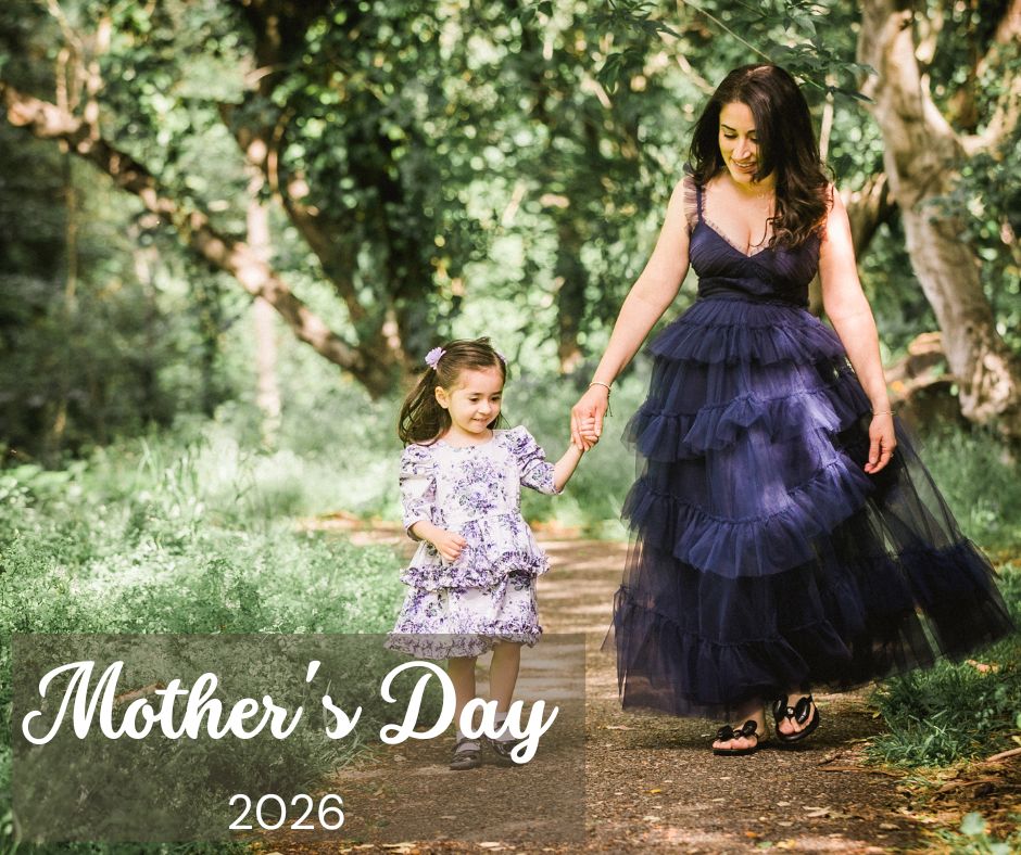 mom holds hand with small girl in filoli gardens in woodside