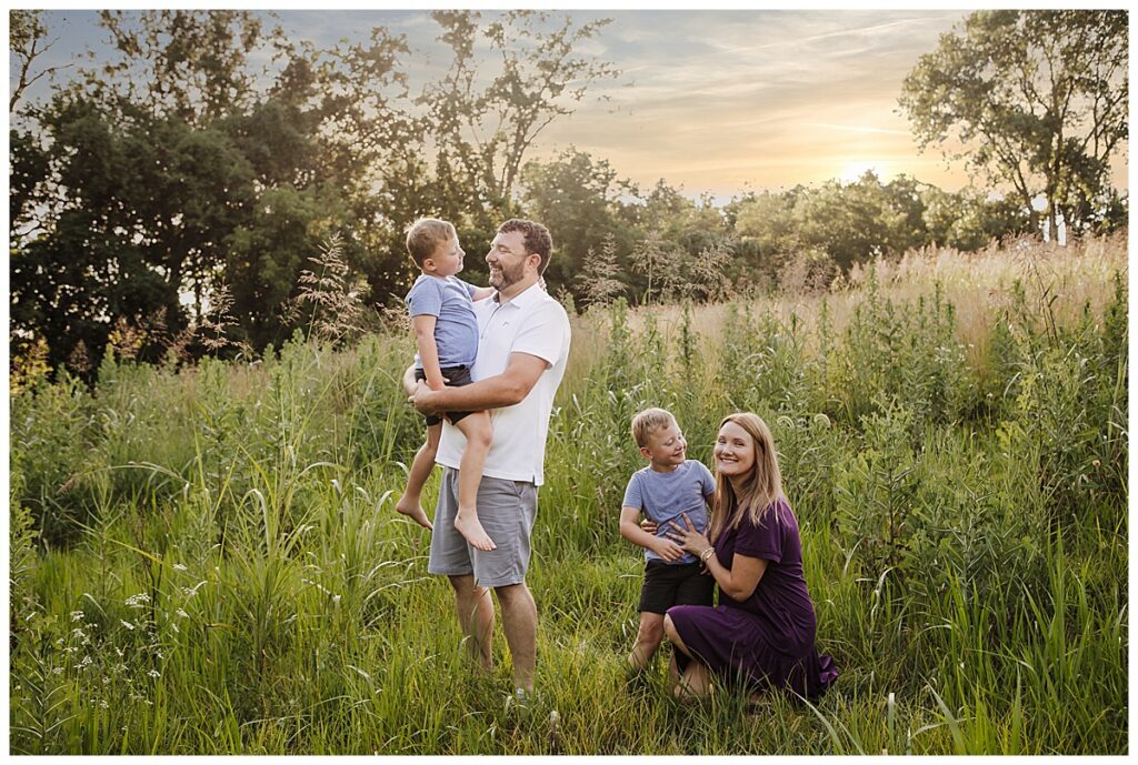 St. Louis Family Photographer: Half My Year (and All My Heart) Is Heremother, father and 4 year old twin boys play in a park in O'Fallon, Illinois